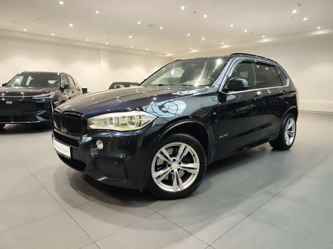 BMW X5 50i 4.4 AT (450 л.с.) 4WD